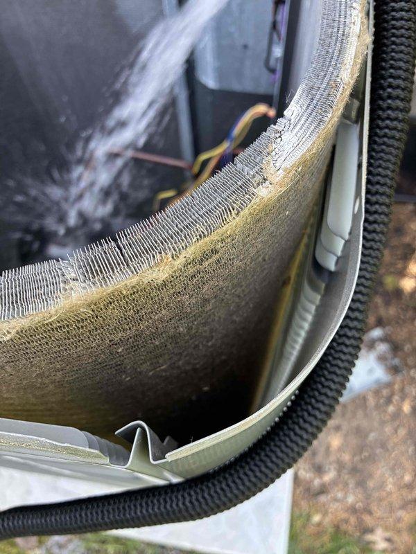 Performed routine cooling system maintenance on residential HVAC unit. Upon inspection, discovered significant accumulation of dust, dirt, and debris on evaporator coil fins, particularly concentrated in center and right sections which can restrict airflow and reduce system efficiency. Cleaned evaporator coil thoroughly to restore proper heat transfer capability. Conducted electrical diagnostics using clamp meter at outdoor unit, recording amperage readings of 46.4A and 0.08A to verify compressor and system component operation within manufacturer specifications. Inspected condensate drain line, electrical connections, and control board for proper function. System restored to optimal operating condition with improved airflow through clean coil assembly.