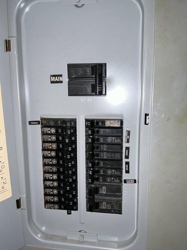 Conducted on-site electrical assessment for whole-house generator installation. Evaluated existing 200-amp main service panel (Thomas brand) and exterior meter base configuration to determine compatibility and transfer switch placement requirements. Documented current electrical infrastructure including main breaker panel layout, circuit distribution, exterior meter housing location, and available conduit pathways along building exterior for future generator connection and automatic transfer switch installation.