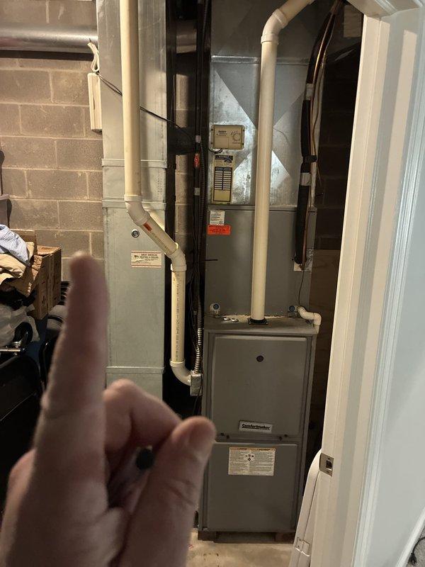 Conducted comprehensive assessment of existing HVAC system for replacement estimate. Evaluated 20-year-old heating and cooling equipment located in basement mechanical room, including furnace unit and associated ductwork distribution system throughout the property. Documented current system configuration, including air handler, plenum assembly, PVC drainage and venting infrastructure, and metal ductwork installation in attic space with supporting framework and insulation. Provided detailed replacement recommendations based on equipment age, system efficiency, and structural requirements for new installation.