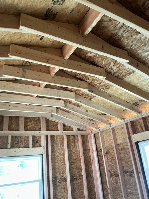 Performed electrical estimate for fixture installation and outlet verification in active residential renovation space. Assessed framing structure with exposed studs, OSB sheathing, and insulation to determine optimal placement for electrical outlets, switches, and lighting fixtures throughout the construction area. Coordinated with on-site contractor to evaluate electrical requirements for the project and documented existing conditions via photographs for estimate preparation.