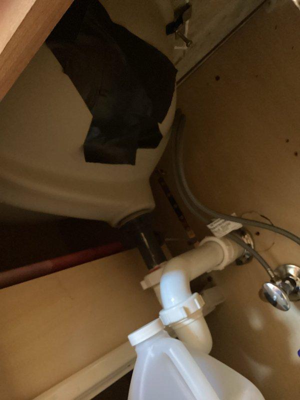 Responded to service call for damaged bathroom sink. Upon inspection, confirmed that existing porcelain sink had developed a crack that penetrated completely through the basin, rendering it non-functional and requiring full replacement. Documented the damage with photographs showing the compromised sink surface and existing plumbing configuration beneath the fixture. Assessed the current drain assembly including P-trap, supply lines, and shut-off valves to determine compatibility with replacement sink installation.
