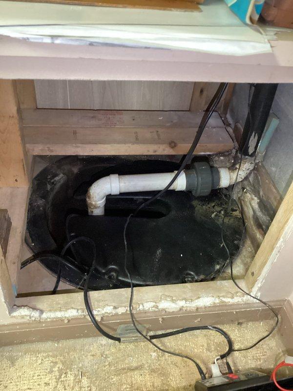 Responded to service call for non-operational sump pump system. Upon inspection, observed sump pump submerged in basin with murky water and backup battery unit present in storage area. Customer requested specific technician for follow-up appointment to assess pump condition and determine if replacement is necessary.