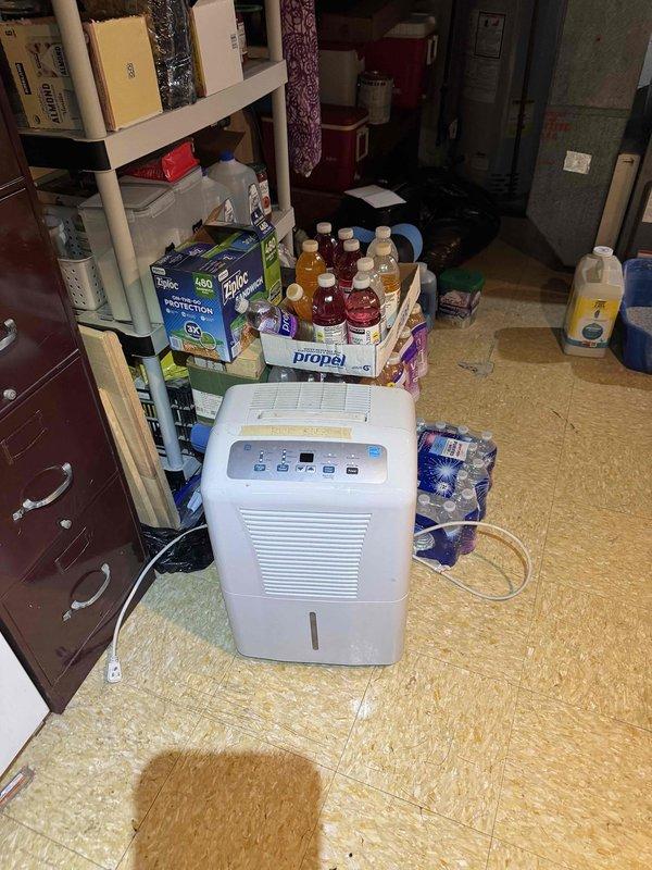 Returned to property to complete installation of portable dehumidifier unit in basement utility area. Unit was positioned on existing flooring, connected to power supply, and tested to verify proper operation of all controls and functions.