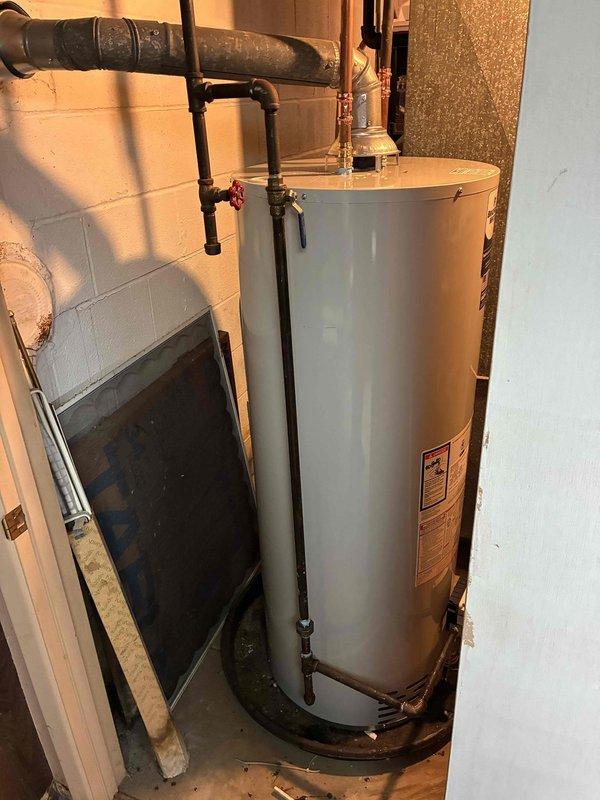 Installed 50-gallon residential water heater with expansion tank in basement utility area. Completed all necessary plumbing connections including hot and cold water lines with shutoff valves, and ensured proper integration with existing HVAC and plumbing systems. Unit is fully operational and tested for proper function.