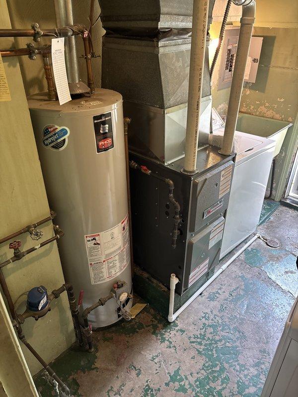 Completed installation of 96% efficiency furnace system in residential basement utility area. Unit was properly positioned, vented with metallic ductwork, and connected to existing air handler system. Customer requested technician wait on-site for their arrival before finalizing installation. All equipment tested and operational upon completion.