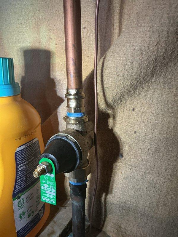 Responded to callback for leaking valve on hot water heater that was recently replaced. Upon arrival, inspected the brass valve assembly and compression fittings connecting to the water heater inlet. Identified active leak at valve connection point. Tightened compression fittings and verified proper seating of all connections. Tested system under pressure to confirm leak was resolved and all joints remained dry during operation.
