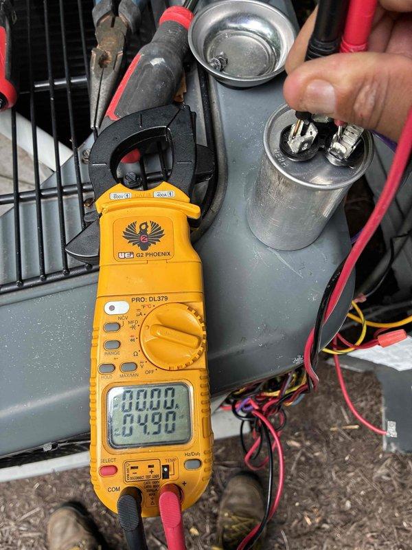 Responded to no-power complaint on residential air conditioning system. Upon inspection, diagnosed failed run capacitor preventing compressor and condenser fan operation. Removed defective capacitor, tested specifications with digital multimeter, and installed replacement 370VAC capacitor with proper wire connections. Verified system startup and confirmed normal operation restored.