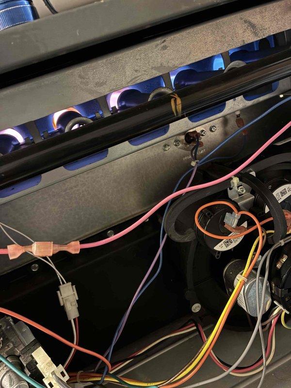 Completed comprehensive heating system maintenance on gas furnace unit. Performed thorough inspection of burner assembly, confirming proper ignition and flame characteristics with all burners producing consistent blue flames indicating optimal combustion efficiency. Examined blower wheel assembly, noting dust accumulation on fins but confirming structural integrity and operational functionality. Inspected electrical control system including wiring connections, capacitor, and control board terminals to ensure secure connections and proper component operation. All system components tested and verified to be functioning within normal parameters for safe and efficient heating operation.