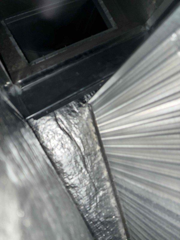 Completed first-year cooling maintenance on HVAC system per MVP agreement. Inspected condenser unit fan assembly, verified proper operation of fan motor and blades, and documented system condition. Identified condensation accumulation on flexible ductwork in mechanical space, indicating proper system cooling operation during inspection.