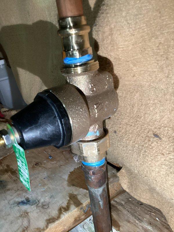 Responded to callback for leaking plumbing connection. Upon inspection, identified active leak at brass elbow fitting assembly with visible moisture condensation throughout the connection points. Repaired faulty threaded connections, replaced compromised O-rings at upper and lower connection points, and resealed joints with appropriate threadlocker compound. Verified all fittings were properly tightened and tested system for leaks under pressure. Connection assembly now functioning properly with no visible leakage.