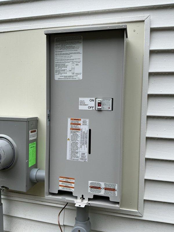 Completed electrical estimate for residential generator installation. Customer has existing hook-up components on-site. Evaluated current electrical service panel and meter configuration mounted on exterior wall, including existing transfer switch with ON/OFF capability. Assessed backyard installation area where underground utility work is in progress, noting PVC conduit and drainage lines already positioned for generator pad placement. Documented existing electrical infrastructure and site conditions to provide accurate estimate for generator connection and final installation requirements.