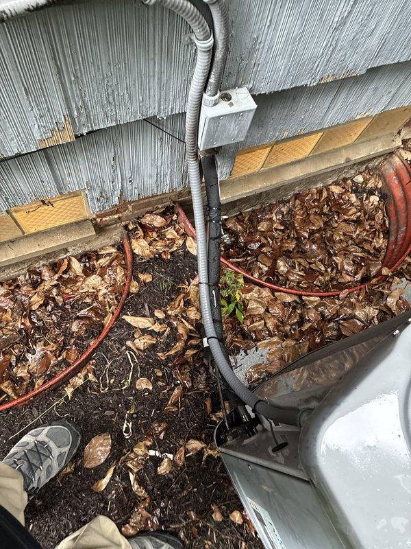 Conducted on-site assessment of existing HVAC system for replacement estimate. Evaluated indoor furnace and air handler equipment located in basement mechanical room, noting current airflow configuration and system layout. Inspected outdoor unit placement and utility connections, including electrical conduit routing and refrigerant line positioning along exterior wall with metal siding. Documented equipment accessibility and existing infrastructure to provide comprehensive replacement options for complete system upgrade.