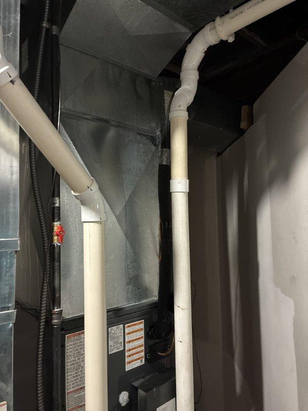Completed full HVAC system installation including two S-Series units, two humidifiers, and two air scrubbers in residential basement mechanical room. All equipment properly mounted, connected with appropriate PVC condensate drainage, ductwork, electrical conduit, and gas lines per manufacturer specifications and local code requirements.