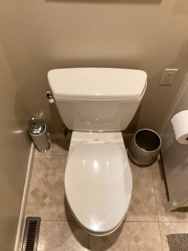 Pulled and reset toilet to address sealing issues. Removed toilet from floor flange, inspected wax ring and flange condition, and reinstalled toilet with new wax seal to ensure proper seating and prevent leaks.