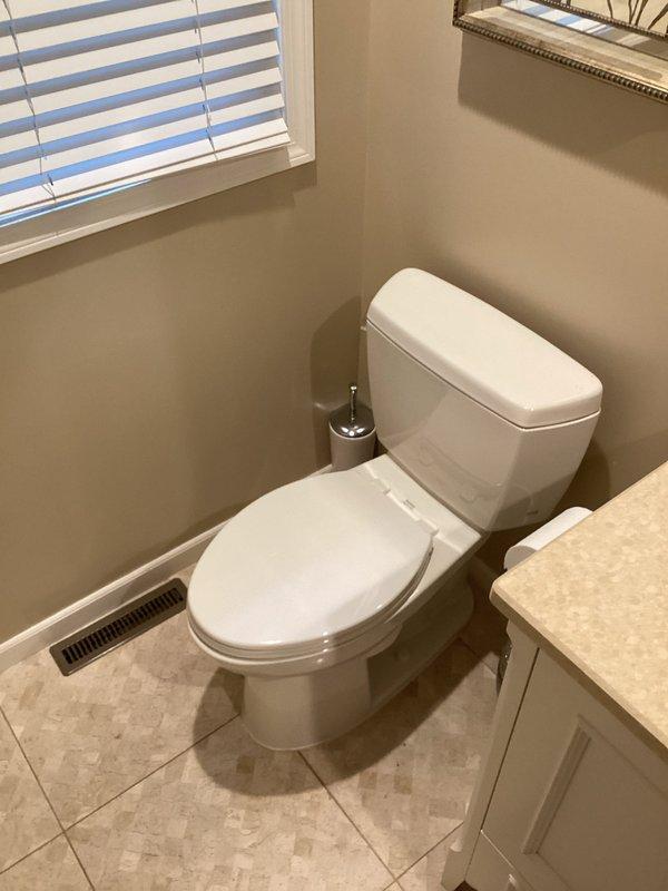 Pulled and reset toilet to address sealing issues. Removed toilet from floor flange, inspected wax ring and flange condition, and reinstalled toilet with new wax seal to ensure proper seating and prevent leaks.