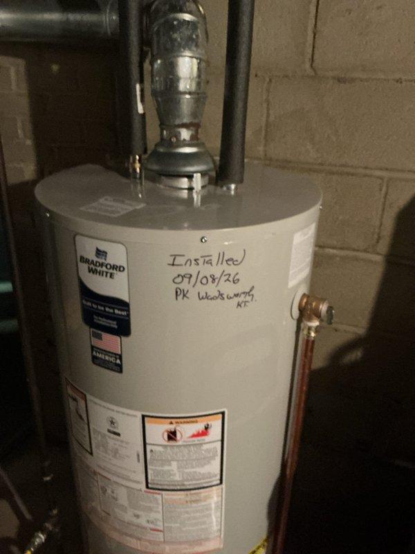 Responded to reported leak under gas water heater with visible water accumulation. Upon arrival, inspected Bradford White gas water heater unit and surrounding plumbing connections. Identified source of leak, performed necessary repairs to stop water discharge, and verified all connections were secure and functioning properly. Unit tested and confirmed operational with no further leakage detected.