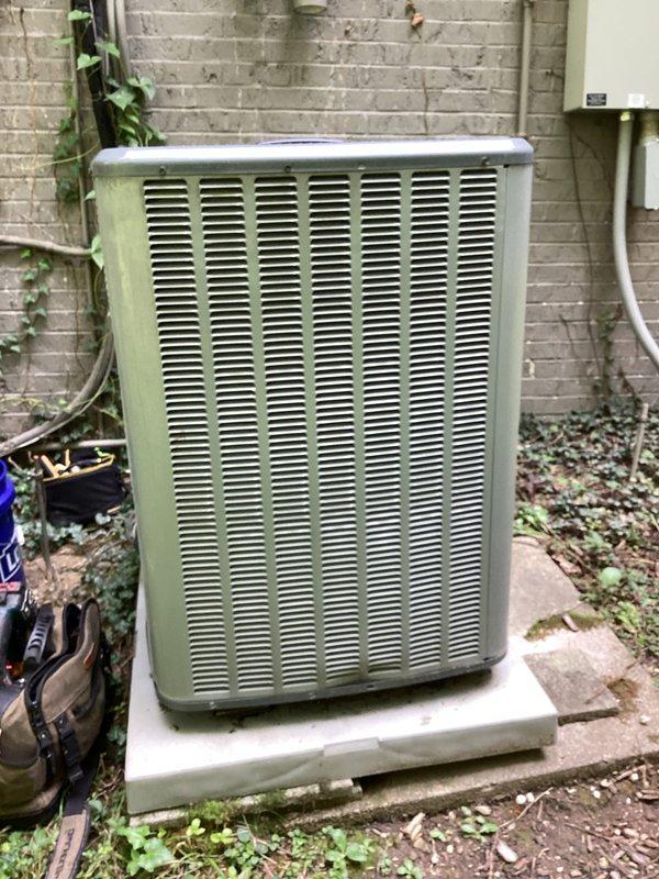 # HVAC Cooling Maintenance - 2 Systems

Performed comprehensive preventive maintenance on two residential air conditioning systems as part of scheduled recurring service plan. Both outdoor condenser units were inspected, tested, and serviced to ensure optimal cooling performance and system reliability.

## Work Performed

**System Diagnostics and Testing:**
- Connected manifold gauges to service ports on both units to measure refrigerant pressures and verify proper system charge
- Evaluated refrigerant line conditions, noting age-related patina on copper lines with connections intact and secure
- Assessed electrical connections and conduit routing for both systems
- Verified proper unit operation and cycling

**Equipment Inspection:**
- Inspected both condenser units positioned on concrete pads with adequate clearance
- Examined cabinet condition, louver panels, and ventilation components
- Checked manufacturer specification labels for reference data
- Evaluated mounting stability and 
