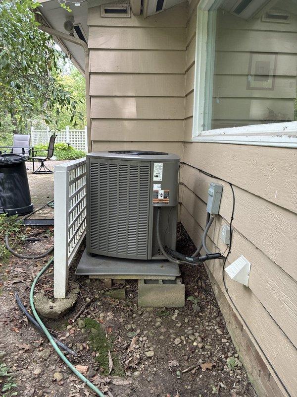 Completed comprehensive site assessment for furnace replacement project. Documented existing HVAC infrastructure including indoor electrical service closet housing furnace wiring, electrical panel, and associated disconnect components. Evaluated outdoor condensing unit installation, noting current positioning on concrete pad with proper clearances and electrical connections. Assessed existing ductwork access points, electrical service capacity, and equipment mounting locations to determine optimal replacement equipment specifications and installation requirements.