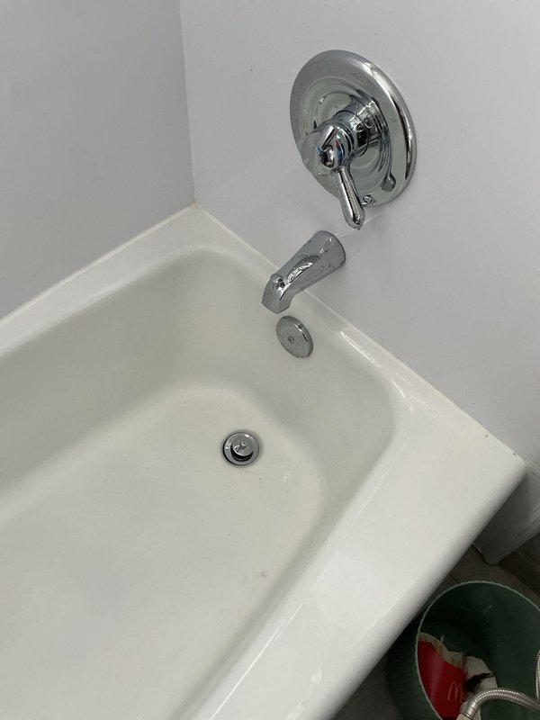 Replaced malfunctioning diverter spout on bathtub and installed new shut-off valve in laundry room to restore proper water control. Successfully snaked and cleared tub drain to eliminate blockage and restore proper drainage function.