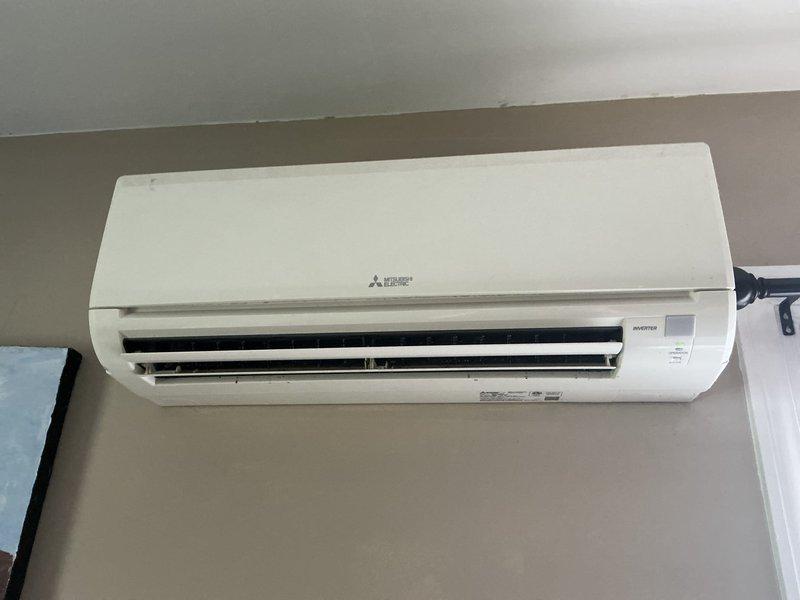 Completed scheduled preventive maintenance on Mitsubishi Electric ductless mini-split cooling system. Inspected and documented condition of wall-mounted indoor air handler unit and accessed multi-stage filtration system, noting moderate dust and debris accumulation on filter media requiring cleaning per manufacturer specifications.