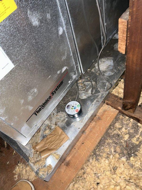 Completed HVAC system replacement with installation of new TruClimate air handler unit in attic space. Unit was properly positioned on platform with refrigerant lines and electrical conduits connected, and access panel installed in wall for future service accessibility.