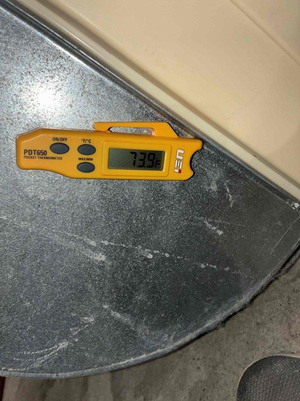 Completed scheduled preventive maintenance on residential cooling system. Performed comprehensive system diagnostics including temperature and electrical measurements, verified proper amperage draw of 400A and ambient temperature readings of 73.9°F at indoor unit and 24.2°C at outdoor condenser unit. All components operating within manufacturer specifications with no deficiencies noted.