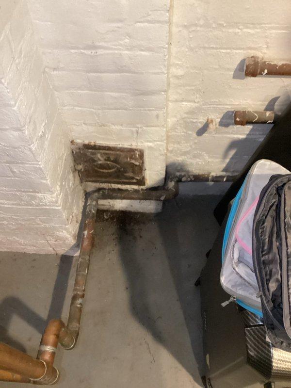 Responded to service call for corroded copper piping connected to boiler system. Upon inspection, identified severely deteriorated copper pipes with extensive oxidation, corrosion, and surface degradation on overhead plumbing infrastructure. The uppermost pipe exhibited the most critical deterioration with white and brown discoloration indicating advanced corrosion. Documented conditions with photographs showing compromised pipe integrity requiring repair or replacement to prevent potential leaks and system failure.