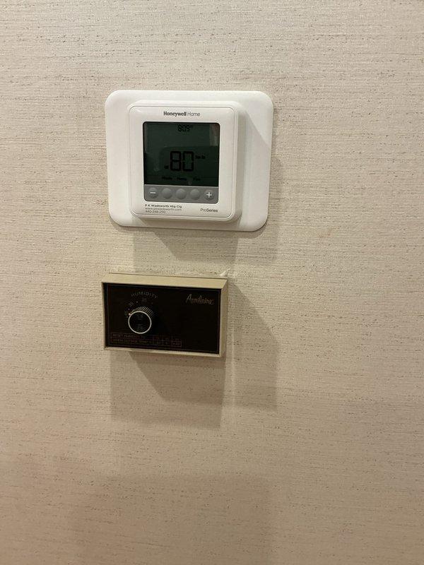 Conducted on-site evaluation for heat pump replacement and provided customer with equipment options and recommendations. Assessed existing electrical infrastructure including circuit breaker panel and verified electrical compatibility for new system installation. Reviewed current climate control setup including Honeywell digital thermostat and humidity control panel to ensure proper integration with replacement heat pump system.
