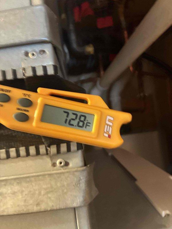 Completed routine cooling system maintenance inspection as part of ongoing preventive maintenance program. Performed temperature readings using digital thermometer, recording 72.8°F at system location, and conducted electrical diagnostics with multimeter to verify proper system operation and performance parameters.
