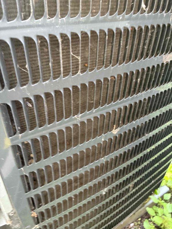 Completed routine HVAC cooling maintenance on residential air conditioning system. Inspected condenser coil assembly and found debris accumulation between fins; verified electrical components and system operation using digital multimeter to ensure proper voltage and performance parameters. Unit operational with all readings within manufacturer specifications.
