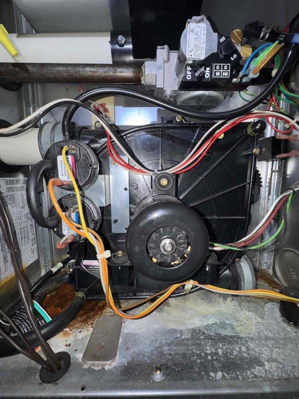 Responded to service call for 18-year-old Carrier furnace repeatedly tripping the circuit breaker. Upon inspection, discovered significant rust and corrosion throughout the unit's cabinet and base, along with deteriorated internal components consistent with the age of the equipment. Evaluated the blower motor assembly, electrical connections, gas valve, and refrigerant lines. Given the extensive corrosion, age of the unit, and safety concerns related to the breaker tripping issue, recommended full system replacement rather than repair due to the likelihood of additional component failures and potential safety hazards.