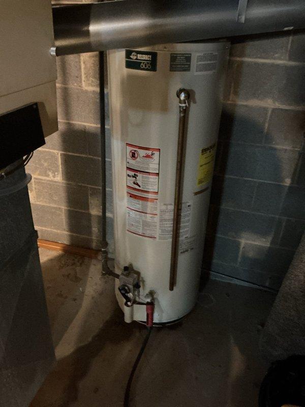 Responded to emergency service call for leaking tanked water heater in basement utility area. Upon inspection, identified active leak requiring immediate attention and documented existing unit condition including plumbing connections, copper piping, valve assemblies, and manufacturer specifications. Assessed water heater installation, surrounding HVAC ductwork clearances, and utility room configuration to determine appropriate repair or replacement options for the customer.