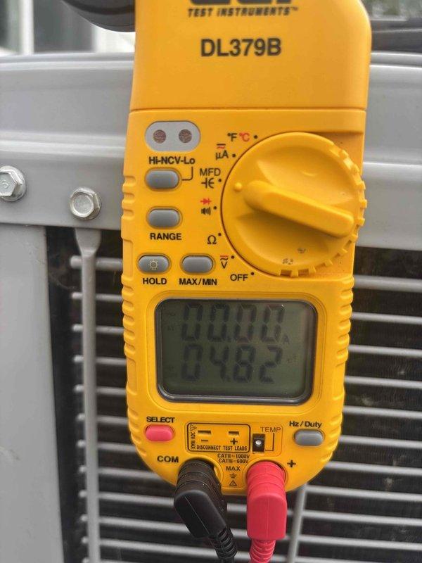 # HVAC Cooling System Maintenance
Completed scheduled preventive maintenance service on residential air conditioning system. Performed comprehensive system inspection and operational testing of outdoor condensing unit. Utilized digital multimeter to verify electrical parameters and capacitor performance, recording measurements to ensure components were operating within manufacturer specifications. Condenser coil appeared clean with good airflow through fins. Inspected exterior foundation area near equipment location, noting standard weathering on lattice skirting and drainage line routing. All system components found to be functioning properly with no immediate service needs identified. Unit operational and ready for continued cooling season performance. # HVAC Cooling System Maintenance
Completed scheduled preventive maintenance service on residential air conditioning system. Performed comprehensive system inspection and operational testing of outdoor condensing unit. Utilized digital multimeter to verify electrical parameters and capacitor performance, recording measurements to ensure components were operating within manufacturer specifications. Condenser coil appeared clean with good airflow through fins. Inspected exterior foundation area near equipment location, noting standard weathering on lattice skirting and drainage line routing. All system components found to be functioning properly with no immediate service needs identified. Unit operational and ready for continued cooling season performance.