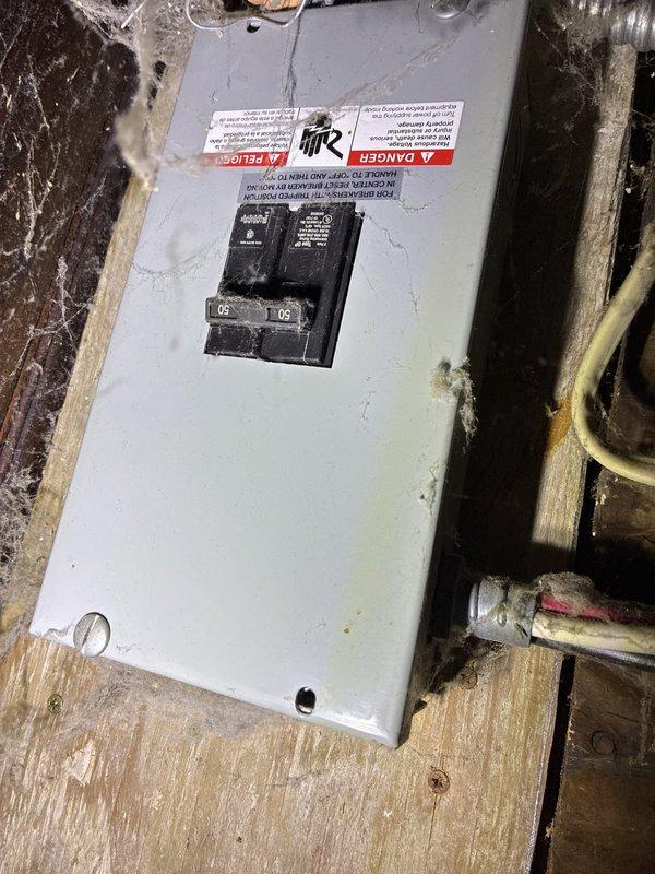 Conducted comprehensive site assessment for central air conditioning system installation at property currently equipped with forced air furnace heating only. Evaluated existing electrical infrastructure, documenting 50-amp circuit breaker panel and main distribution panel condition. Inspection revealed significant corrosion and white powdery deposits throughout electrical panel, indicating potential moisture intrusion and deteriorated connections requiring attention prior to AC installation. Photographed weathered wooden framing around electrical equipment and documented current electrical capacity to determine compatibility with proposed cooling system requirements. Provided customer with add-on options and equipment recommendations for integrating new air conditioning system with existing forced air heating infrastructure.