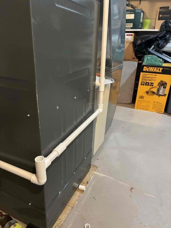 Replaced failed condensate pump on residential air handler unit. Installed new pump assembly and verified proper drainage function through white PVC condensate lines to prevent water overflow and potential equipment damage.