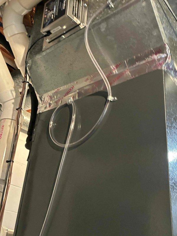 Replaced failed condensate pump on residential air handler unit. Installed new pump assembly and verified proper drainage function through white PVC condensate lines to prevent water overflow and potential equipment damage.