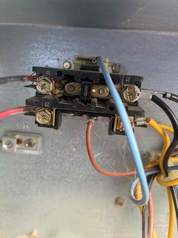 Responded to no cooling complaint on first floor air conditioning system. Upon inspection, found heavily corroded dual run capacitor with significant rust and oxidation on terminals and housing. Contactor assembly also showed signs of age with oxidized terminals and wear consistent with 10+ year old equipment. Removed failed capacitor, cleaned terminal connections, and installed replacement capacitor with proper wire connections to compressor and condenser fan motor circuits. Verified all electrical connections at contactor were secure and tested system operation to confirm cooling restored.