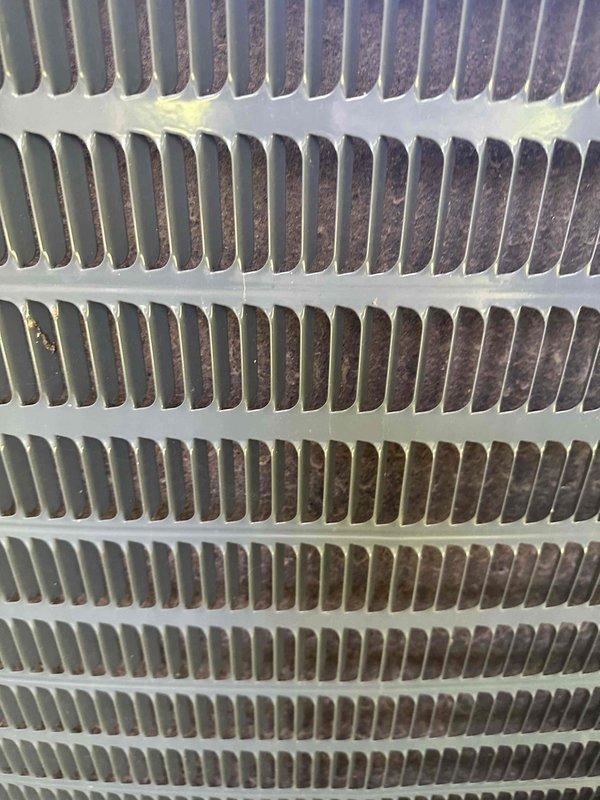 Completed first-year preventative maintenance on two residential cooling systems. Performed comprehensive inspection of outdoor Goodman condenser units, including examination of heat exchanger coils which showed normal operational dirt accumulation on fins and spacer bars. Both systems operating within normal parameters with no immediate service concerns identified.