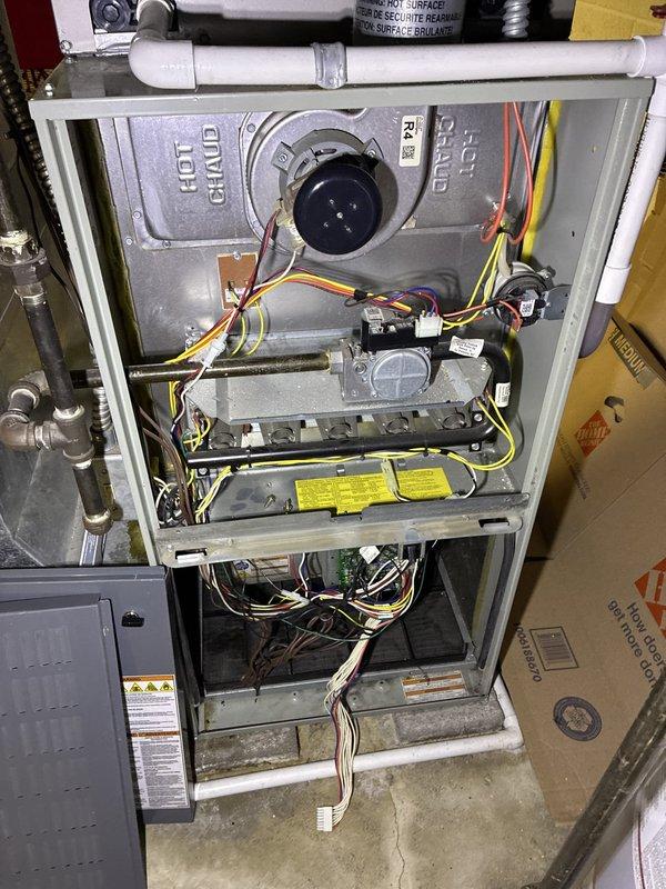 Performed comprehensive assessment of existing gas furnace system for replacement estimate. Evaluated current unit's internal components, burner assembly, blower motor, and electrical connections, noting standard wear and operational condition. Documented accessible installation location and existing venting configuration with PVC piping. Reviewed system specifications and provided replacement options to customer who is comparing multiple quotes for furnace replacement.
