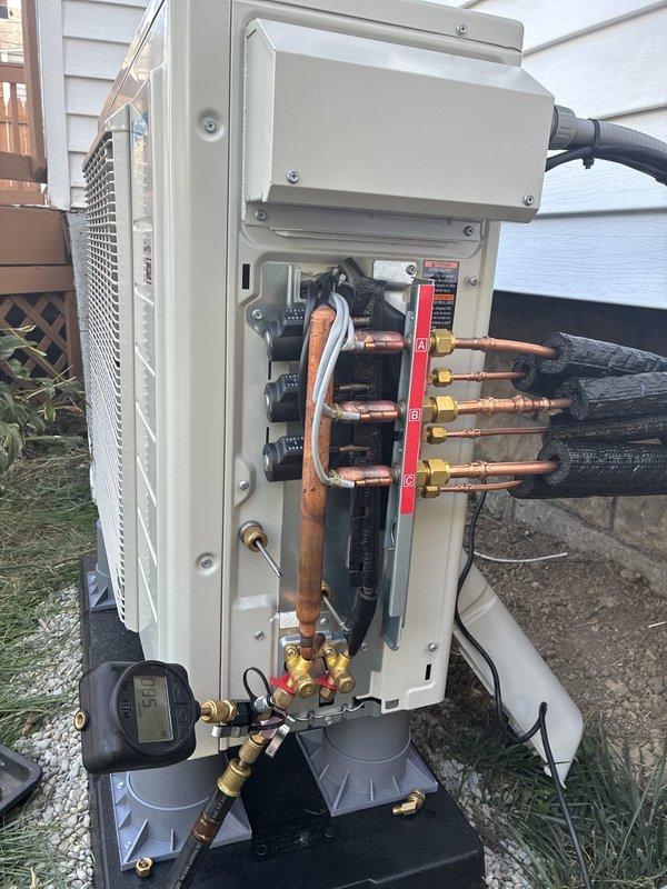 Completed installation of three-zone mini-split system with outdoor condenser unit and indoor air handlers. Installed refrigerant line sets with proper insulation, established electrical connections and dedicated circuit, mounted outdoor unit on platform against building exterior, and ran condensate drainage. System was pressure tested, evacuated, charged with refrigerant, and fully commissioned with all zones operational and performing to manufacturer specifications.