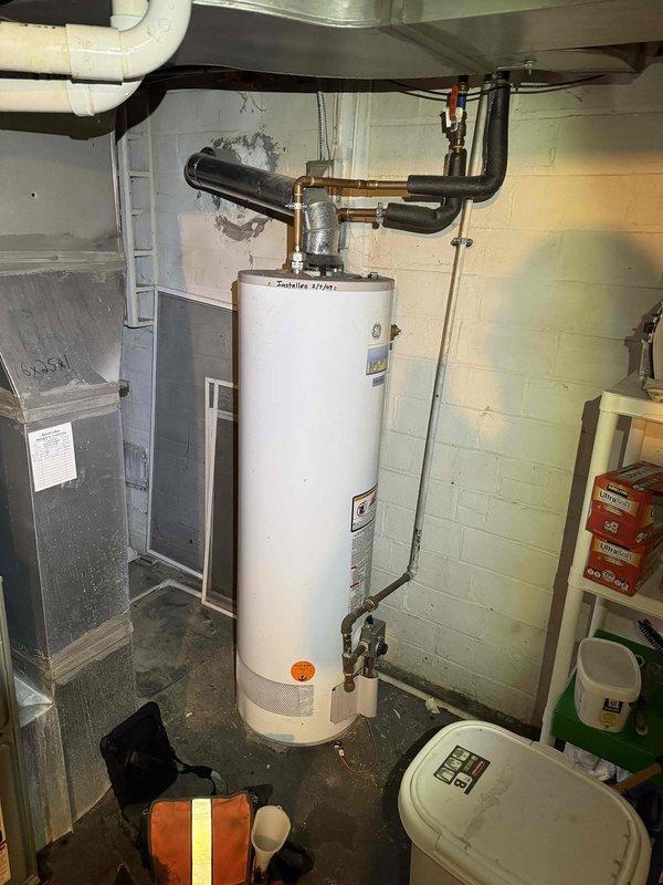 Completed scheduled preventive maintenance on aging residential cooling system as part of ongoing maintenance program. Performed comprehensive inspection of Lennox HVAC unit in basement mechanical room, including filter evaluation, electrical connections verification, and condensate drain line assessment. Documented equipment condition through photographic records showing furnace unit, associated PVC condensate piping, and surrounding mechanical systems including water heater and dehumidifier unit in utility space.