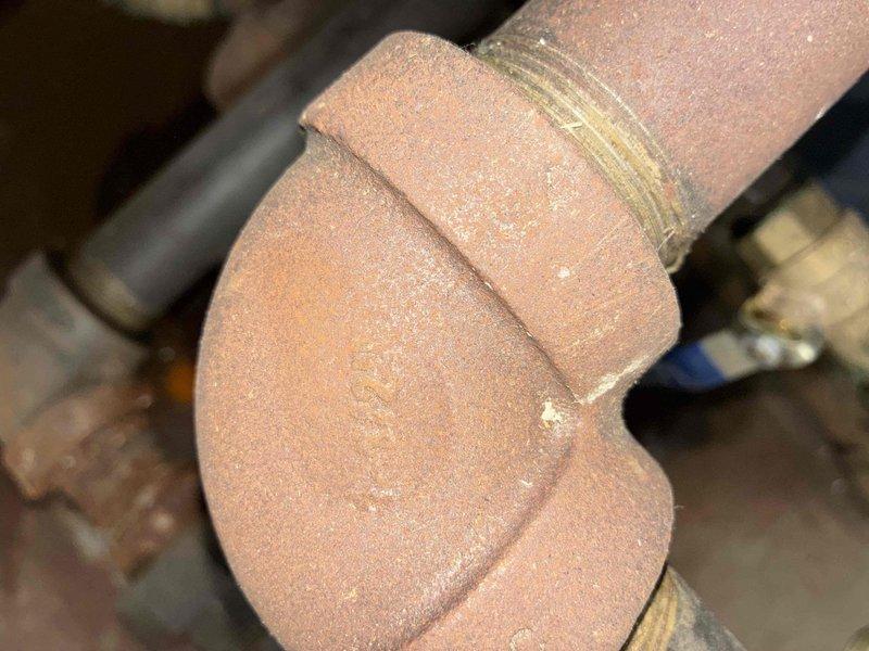 Completed scheduled boiler maintenance and inspection. Accessed and examined copper piping system, including union coupling connections and elbow joints. Inspected plumbing components for proper operation, checking for signs of corrosion and verifying integrity of threaded connections throughout the heating distribution system. Documented existing conditions of copper and mixed plumbing components with photographic records for maintenance history.