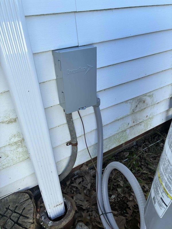 Replaced failed AC disconnect box with new Diversitech unit and installed Zap Pro surge protector to provide equipment protection against electrical surges. New disconnect box properly mounted to exterior siding with conduit lines reconnected to outdoor HVAC unit. Replaced failed AC disconnect box with new Diversitech unit and installed Zap Pro surge protector to provide equipment protection against electrical surges. New disconnect box properly mounted to exterior siding with conduit lines reconnected to outdoor HVAC unit.