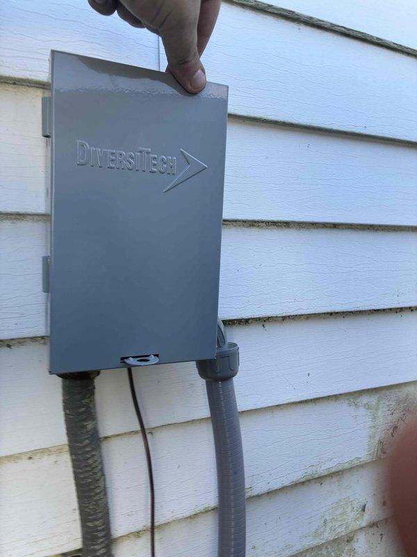 Replaced failed AC disconnect box with new Diversitech unit and installed Zap Pro surge protector to provide equipment protection against electrical surges. New disconnect box properly mounted to exterior siding with conduit lines reconnected to outdoor HVAC unit. Replaced failed AC disconnect box with new Diversitech unit and installed Zap Pro surge protector to provide equipment protection against electrical surges. New disconnect box properly mounted to exterior siding with conduit lines reconnected to outdoor HVAC unit.