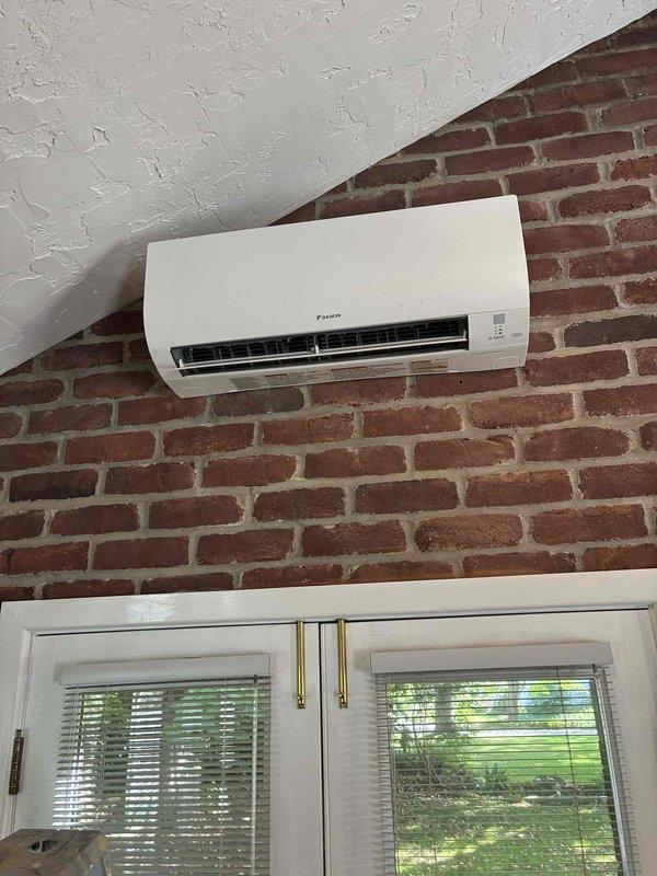 Completed preventive maintenance service on Daikin ductless mini-split system. Inspected and cleaned indoor wall-mounted evaporator unit and outdoor condensing unit, verified proper refrigerant levels, tested system operation in heating mode, and confirmed all components functioning within manufacturer specifications.