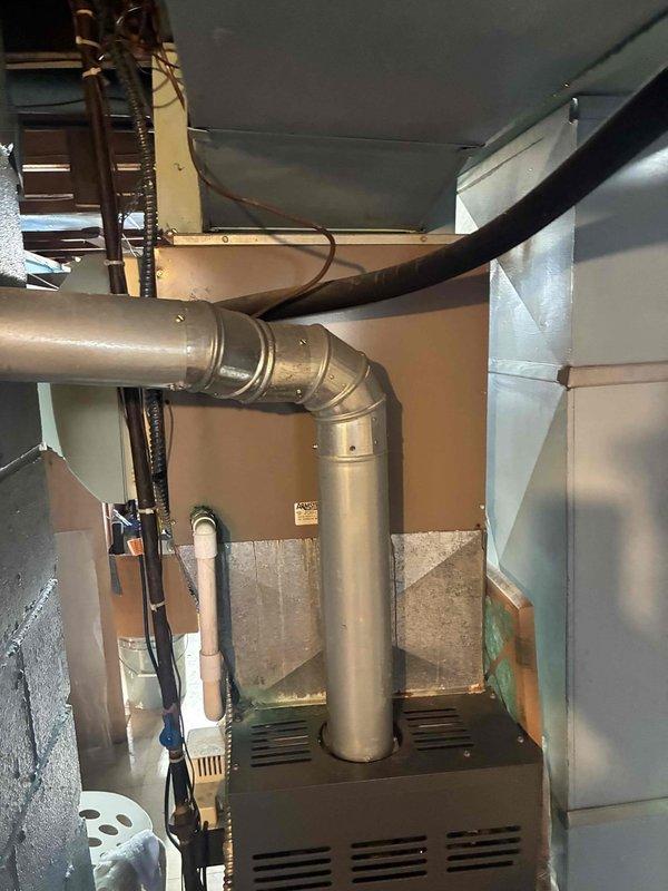 Responded to no cooling complaint at residential property. Upon arrival, accessed HVAC system through side entrance as requested and conducted diagnostic evaluation of heating and cooling equipment. Inspected furnace, ductwork, and air handler assembly in mechanical room. System components showed signs of normal wear but no immediate visible damage to primary equipment. Documented existing conditions of HVAC installation including main supply ductwork, exhaust piping, and air handler configuration. Assessed airflow pathways and ventilation system integrity. Customer reported complete loss of cooling function requiring further diagnostic testing to identify root cause of system failure.
