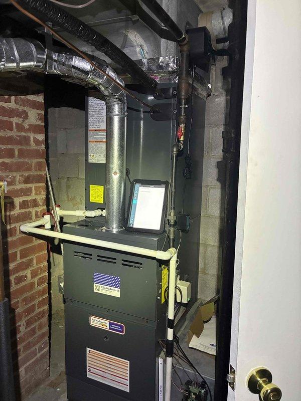Completed scheduled preventive maintenance on residential cooling system. Performed comprehensive inspection of furnace and air handling unit, verified proper operation of PREME air quality monitoring device mounted on ductwork, and confirmed all system components functioning within normal parameters.