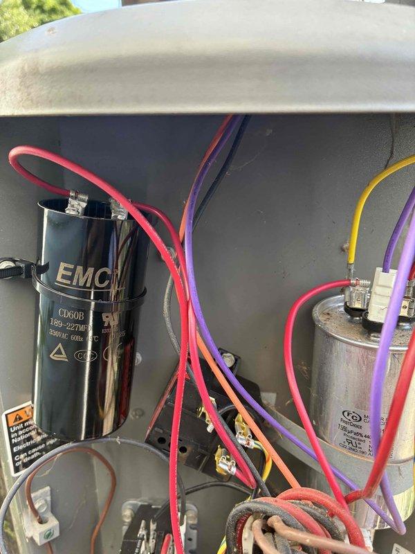 # HVAC Cooling Maintenance Summary

Completed routine preventive maintenance on residential air conditioning system as part of ongoing service plan. Inspected outdoor condensing unit, including visual assessment of dual-run capacitor assembly (EMC CD60B and secondary capacitor), electrical connections, and wiring integrity. Evaluated condenser coil condition through protective grille, noting moderate dust and debris accumulation on fin surfaces. All electrical components, wire connections, and capacitors found in functional condition with no immediate service requirements identified. Unit operational and performing within normal parameters upon completion of maintenance inspection.