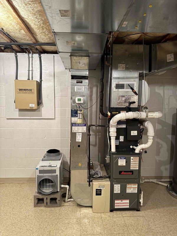 Responded to indoor air quality concern regarding inconsistent humidity readings throughout the home. Customer reported basement dehumidifier displaying 45% relative humidity while unit setpoint was 40%, with readings of 55% observed in other areas of the basement and upstairs levels. Performed system inspection of basement mechanical room equipment including furnace, dehumidification unit, and associated ductwork. Documented equipment installation and operating conditions with photographs for service records.