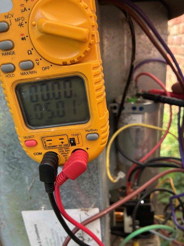 # HVAC Maintenance - Cooling 10+ Years Old

Completed comprehensive heating and cooling maintenance on aging HVAC system. Performed electrical diagnostics using digital multimeter to verify proper voltage and amperage readings across control board and system components. All electrical connections inspected and tested, with readings documented and confirmed within manufacturer specifications. System operational and ready for continued service.